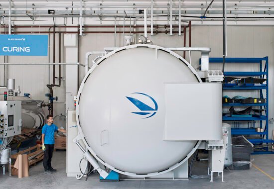 Worker starts the autoclave for the firing of the composed materials.


In 2009 Luciano Belviso and Angelo Petrosillo win a competition announcement of the Puglia Region of 350 thousand euro for the promotion of start-up companies and with the support of a financier, dr. Vito Perth, create Monopoly Blackshape Aircraft. Initially the idea was to produce components for the aerospace district of Grottaglie, where Boeing and Alenia build the fuselages of the 787 Dreamliner (the only large aircraft with carbon components); then, instead, decide to create their own plane made entirely of carbon fiber and for drawing they call one of the three great Italian designers of aircraft, Bepi Vidor, who decides to take part in the project.
In two and a half years Blackshape Aircraft becomes the first industry in the world in the construction of ultralight aircraft carbon fiber (in a market, that of ultrathin, which has 17,000 pilots sport flying only in Europe) and after the two-seater with 1,500 km of autonomy and 340 per hour top speed, already are on track to produce a faster model: in 2015 will come out a "4 seats" EASA certified, that in Italy only Alenia, Agusta and Tecnam build. The "Ferrari of the skies", call their ultralight the two entrepreneurs.
The German magazine Flieger Magazine, by an international panel of 100 independent journalists from all over the world, has awarded the company the award of Monopoly Flieger Magazine Award for realizing the best airplane in the world in 2013 in the ultralight category.